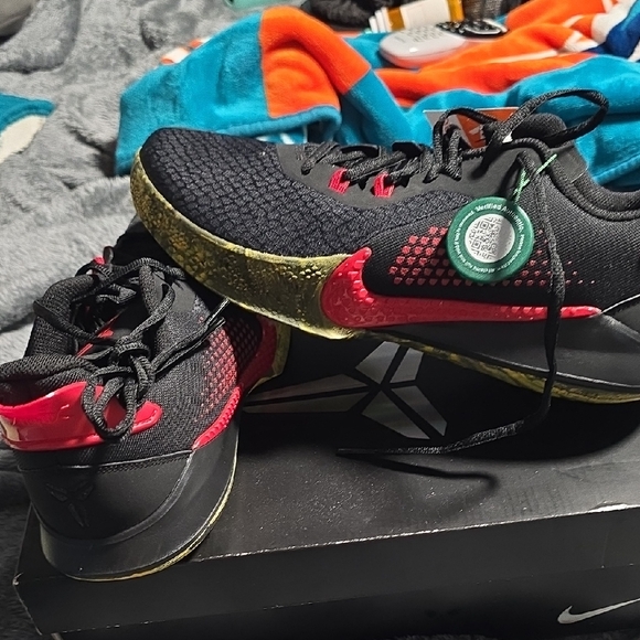 Nike Black and Red Sneakers with Gold Accents